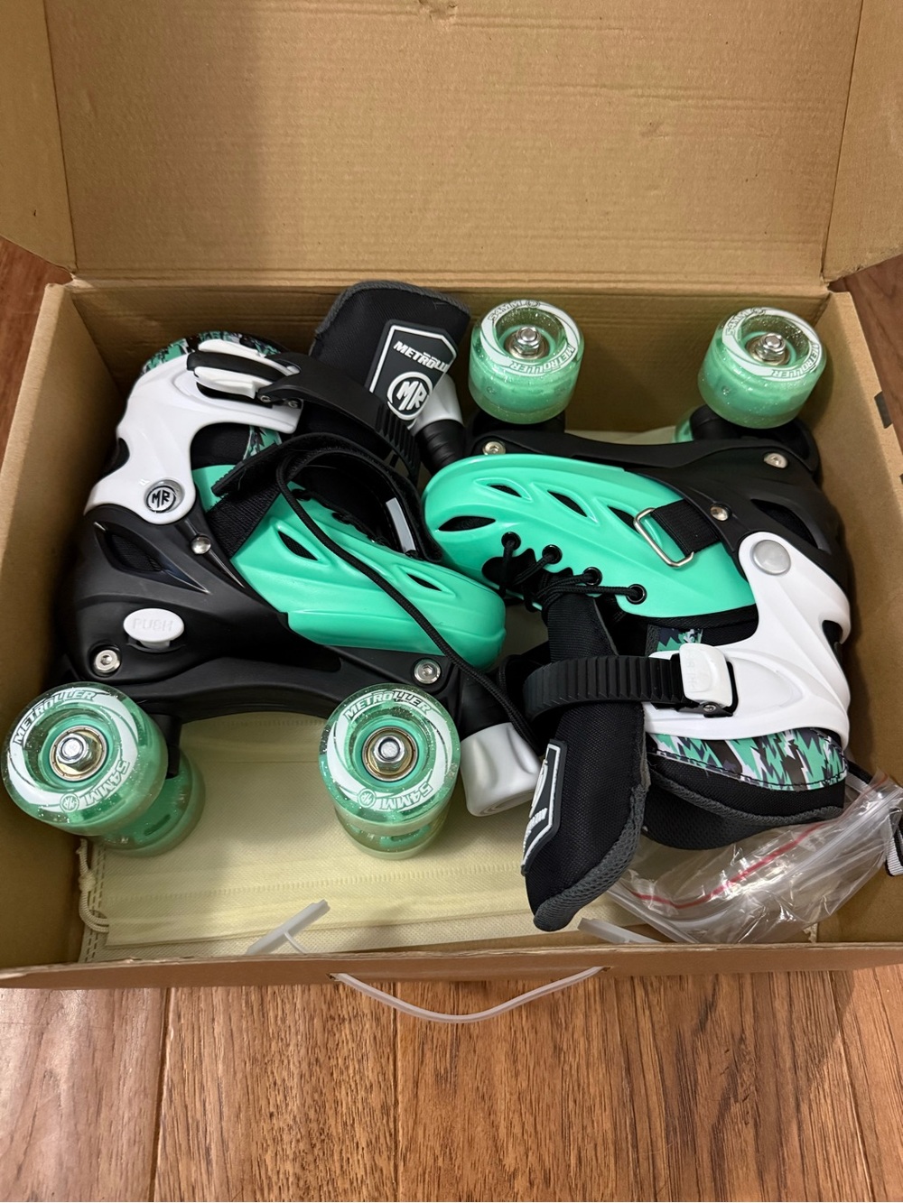 Adjustable Mint Green Kids Roller Skates with Black & White Accents - Unbranded